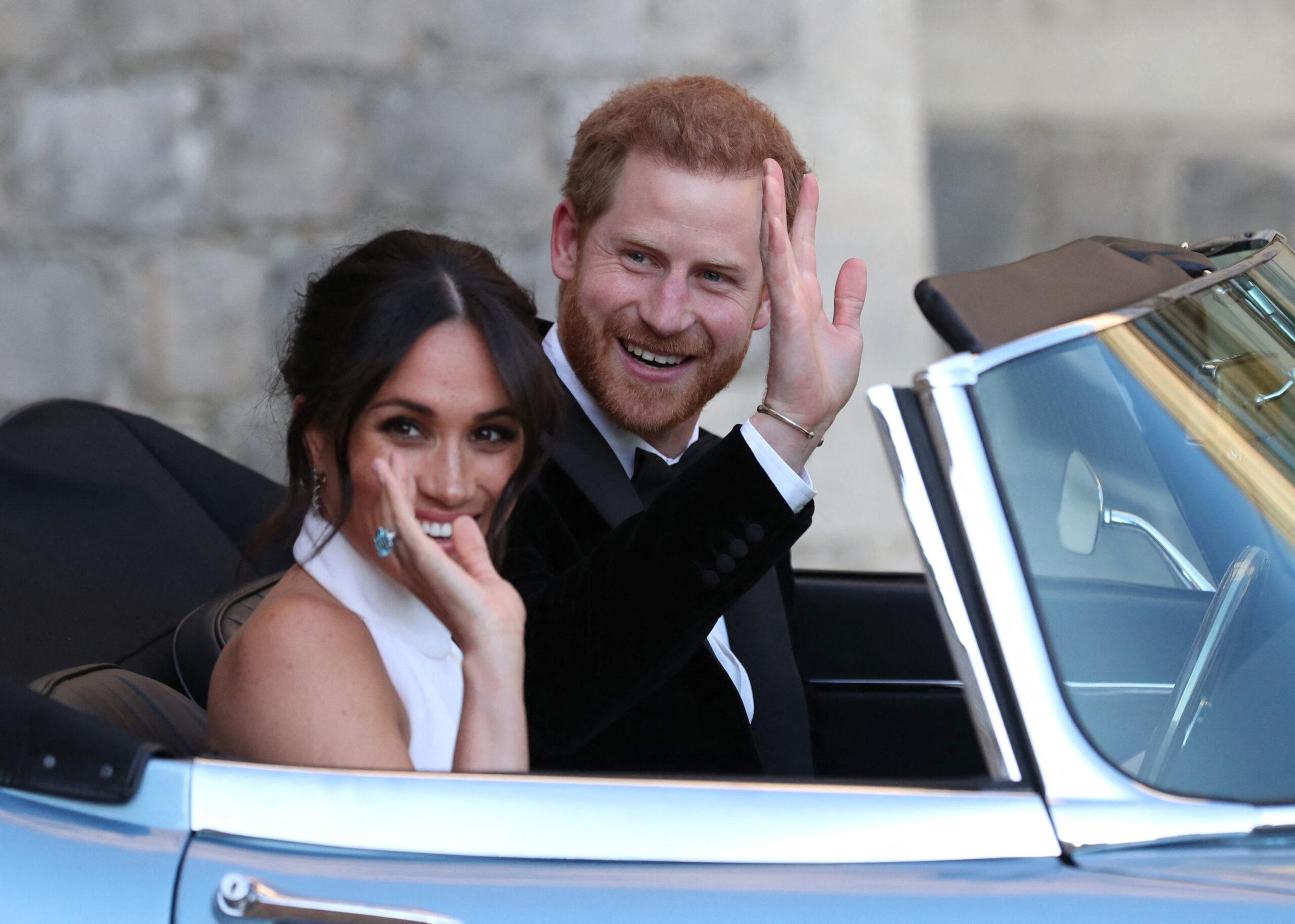 The Duke and Duchess of Sussex drive in an electric Jaguar car
