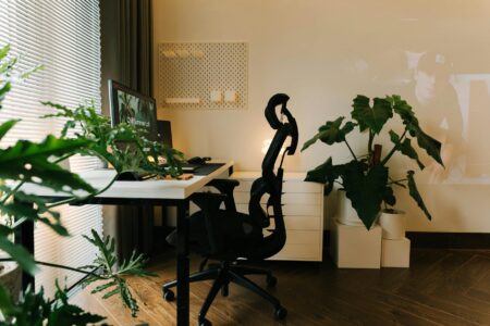 Why Remote Workers Are Hiring Professional Focus Coaches for Deep Work Clean home office workspace with laptop and minimal distractions on wooden desk