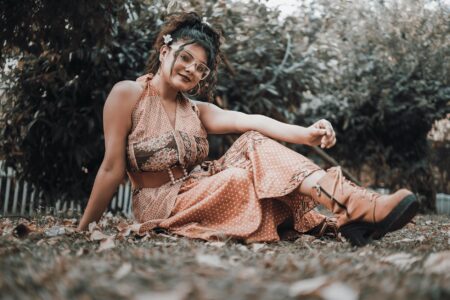 The Revival of 1970s Bohemian Style Thanks to Vanessa Hudgens Woman wearing flowing bohemian style clothing with layered accessories and earthy tones