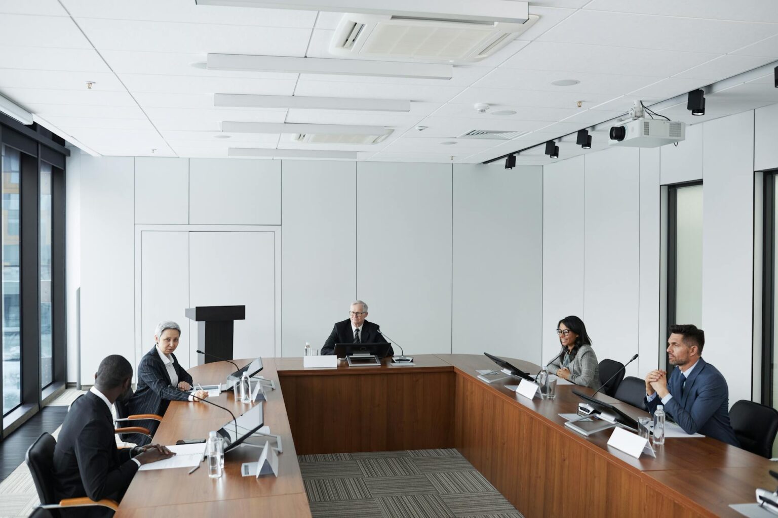 How Ryan Reynolds’ Aviation Gin Marketing Strategy Influenced Celebrity Brand Ownership Professional business meeting discussing brand strategy and marketing plans