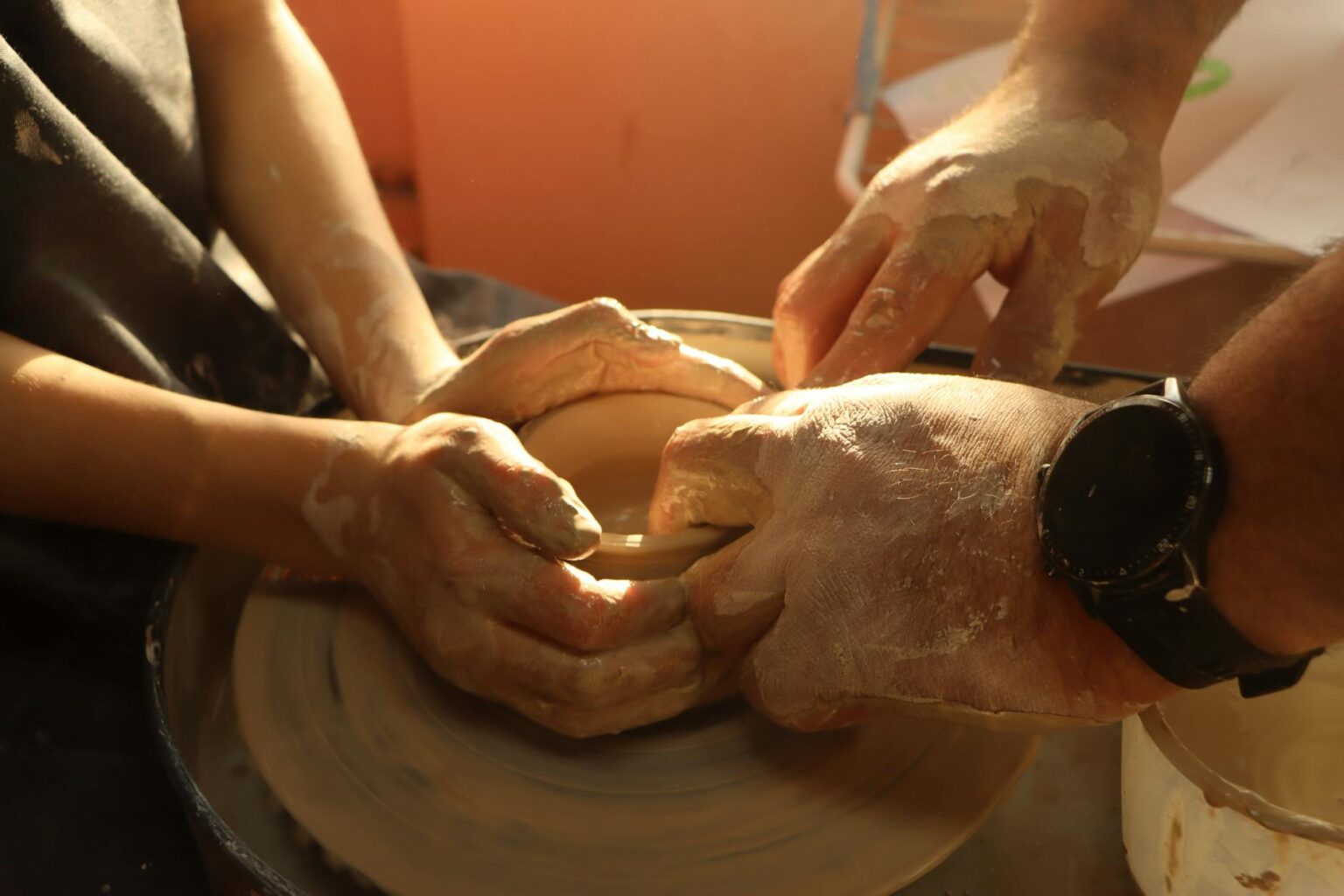How Emma Stone’s Pottery Studio Is Becoming Hollywood’s Creative Retreat Hands working clay on a pottery wheel in a studio setting