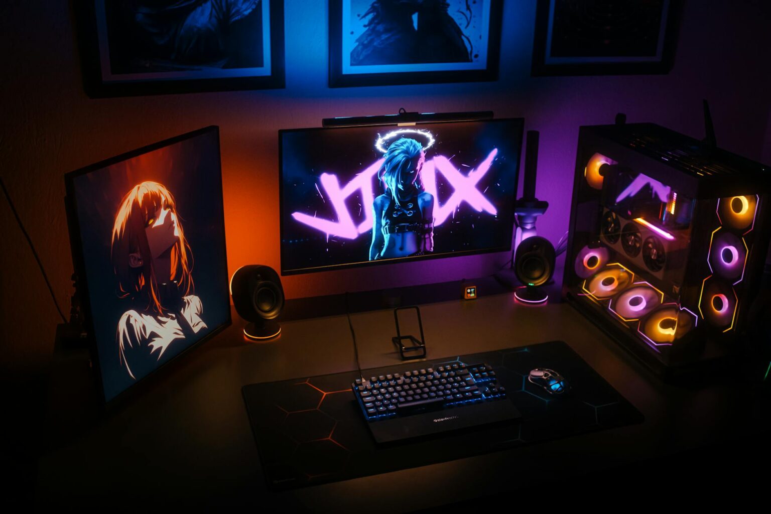 How Celebrity Gaming Streams Are Becoming Prime Time Television Professional gaming setup with multiple monitors, microphone, and streaming equipment in a well-lit room