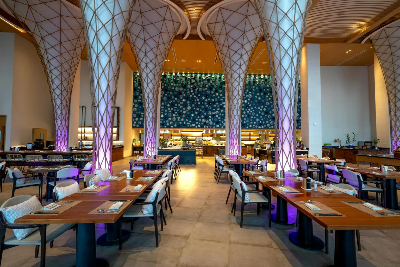 How Michael B. Jordan’s Restaurant Chain Is Revolutionizing Celebrity Dining Ventures Modern restaurant interior with warm lighting and comfortable seating arrangements