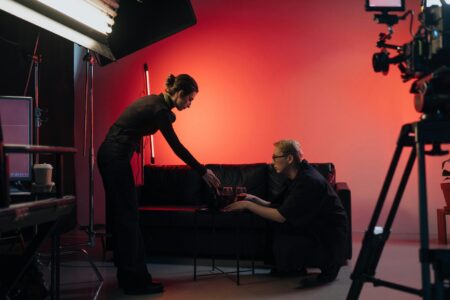 Professional film studio with lighting equipment and cameras set up for production