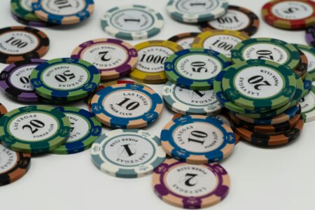How Celebrity Poker Games Are Becoming Exclusive Streaming Content Professional poker chips stacked on green felt table surface
