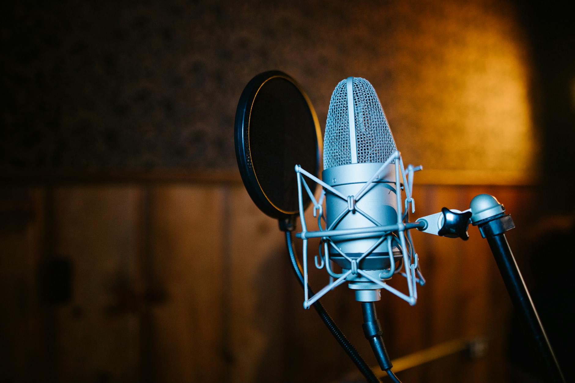 Professional recording studio with microphone and audio equipment for podcast production