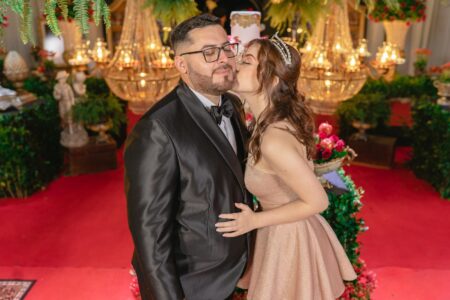 Why A-Listers Are Choosing Unknown Designers for Major Events Elegant evening gown on red carpet with camera flashes in background