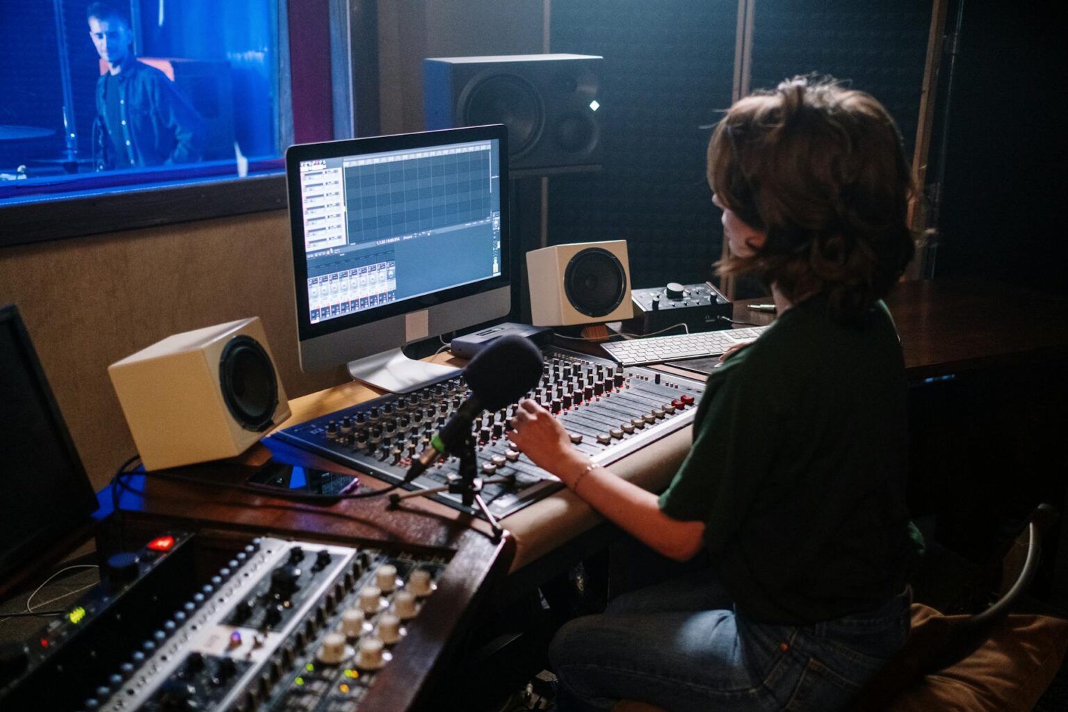 Professional recording studio with mixing console and equipment