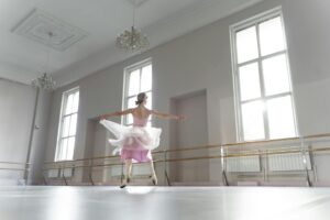 How TikTok Dance Challenges Are Influencing Broadway Choreography Modern dance studio with wooden floors and mirrors where choreographers practice and develop new movements