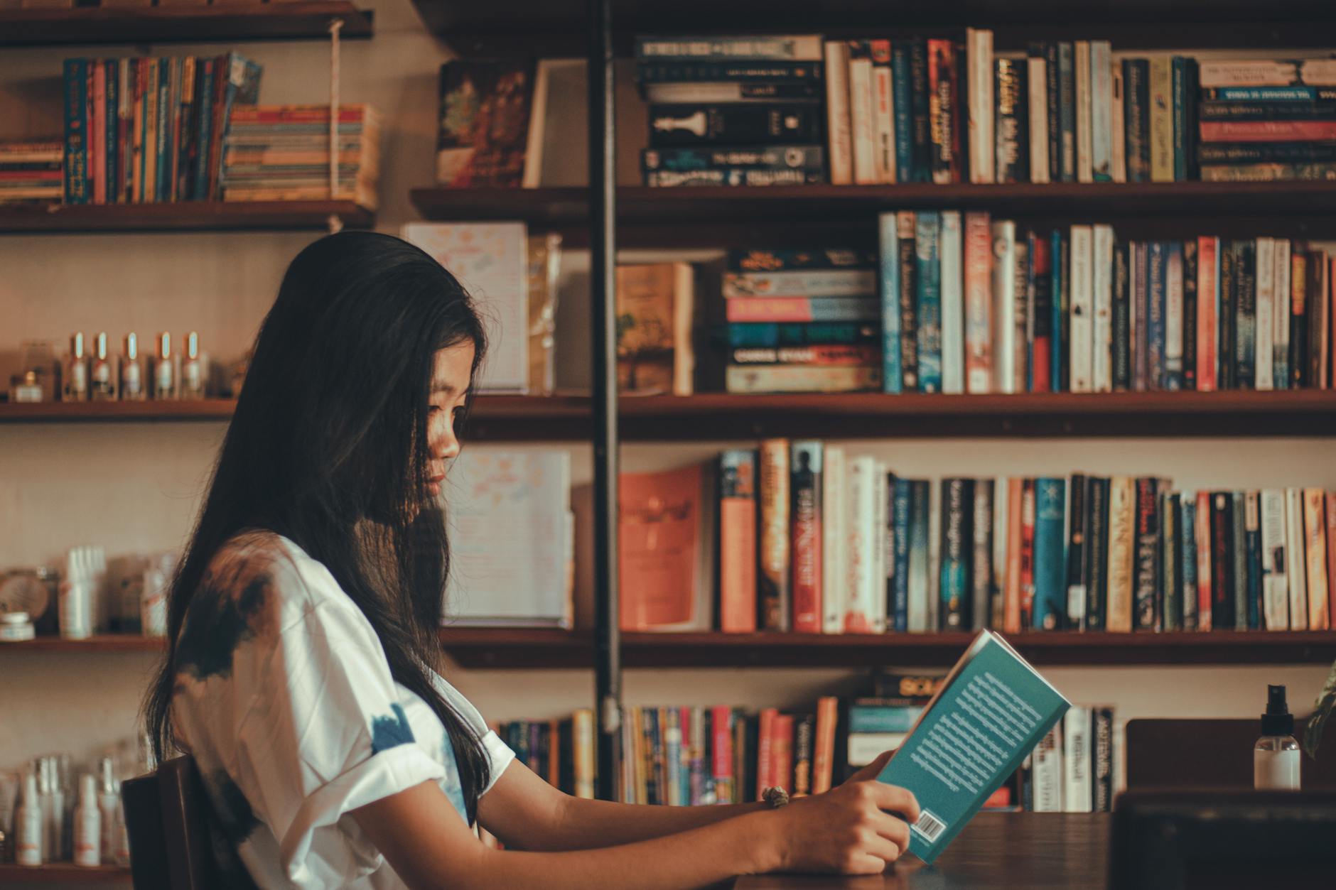 Woman reading a book in comfortable indoor setting