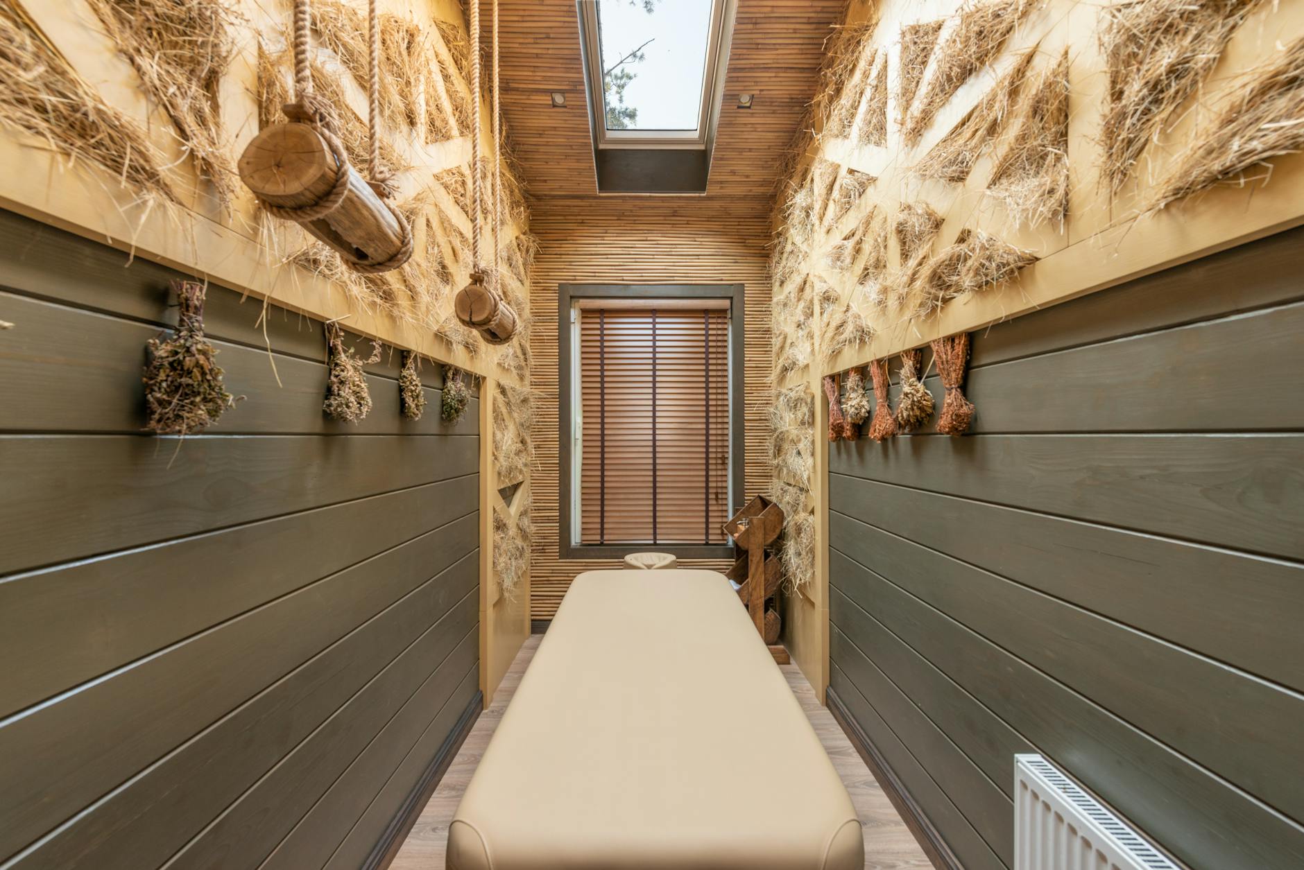 Modern spa treatment room with minimalist design and wellness equipment