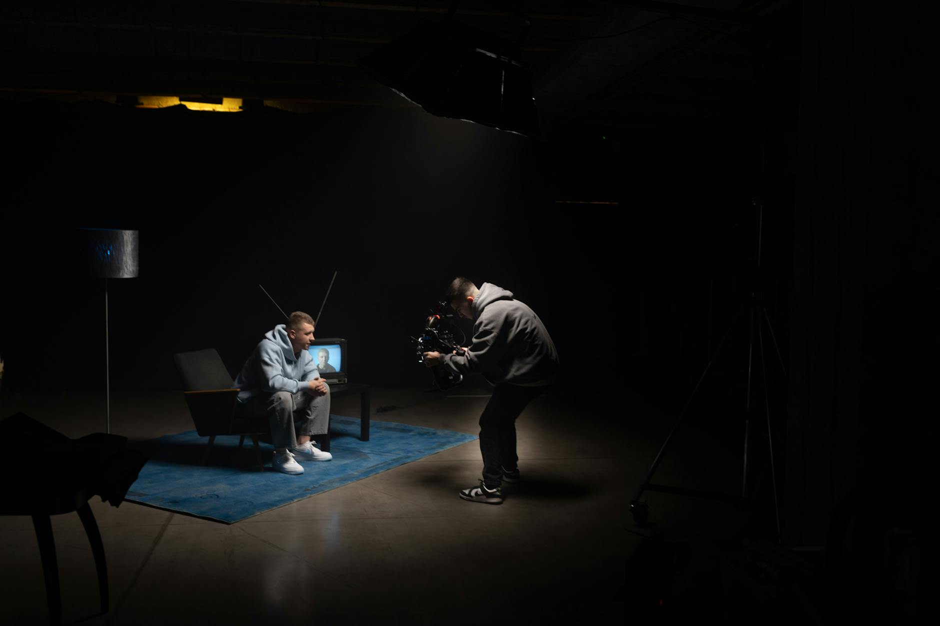 Television production set with cameras and crew filming a scene