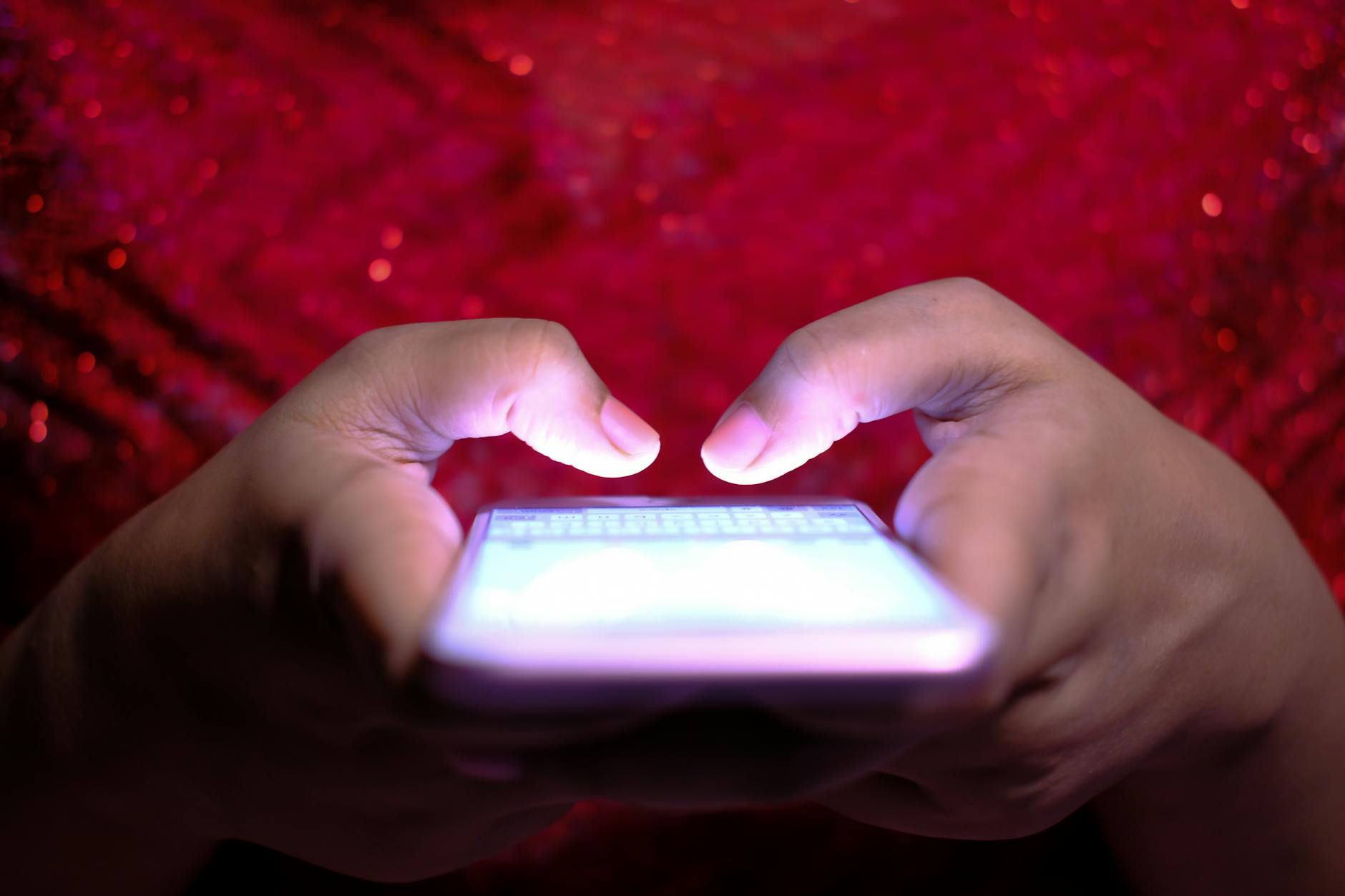 Close-up view of hands holding a smartphone displaying an augmented reality interface