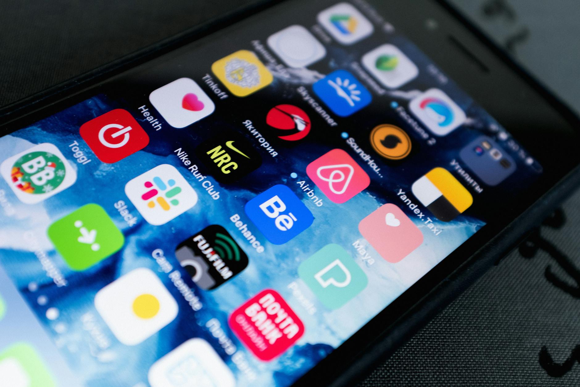 Smartphone screen displaying various mobile applications and digital services