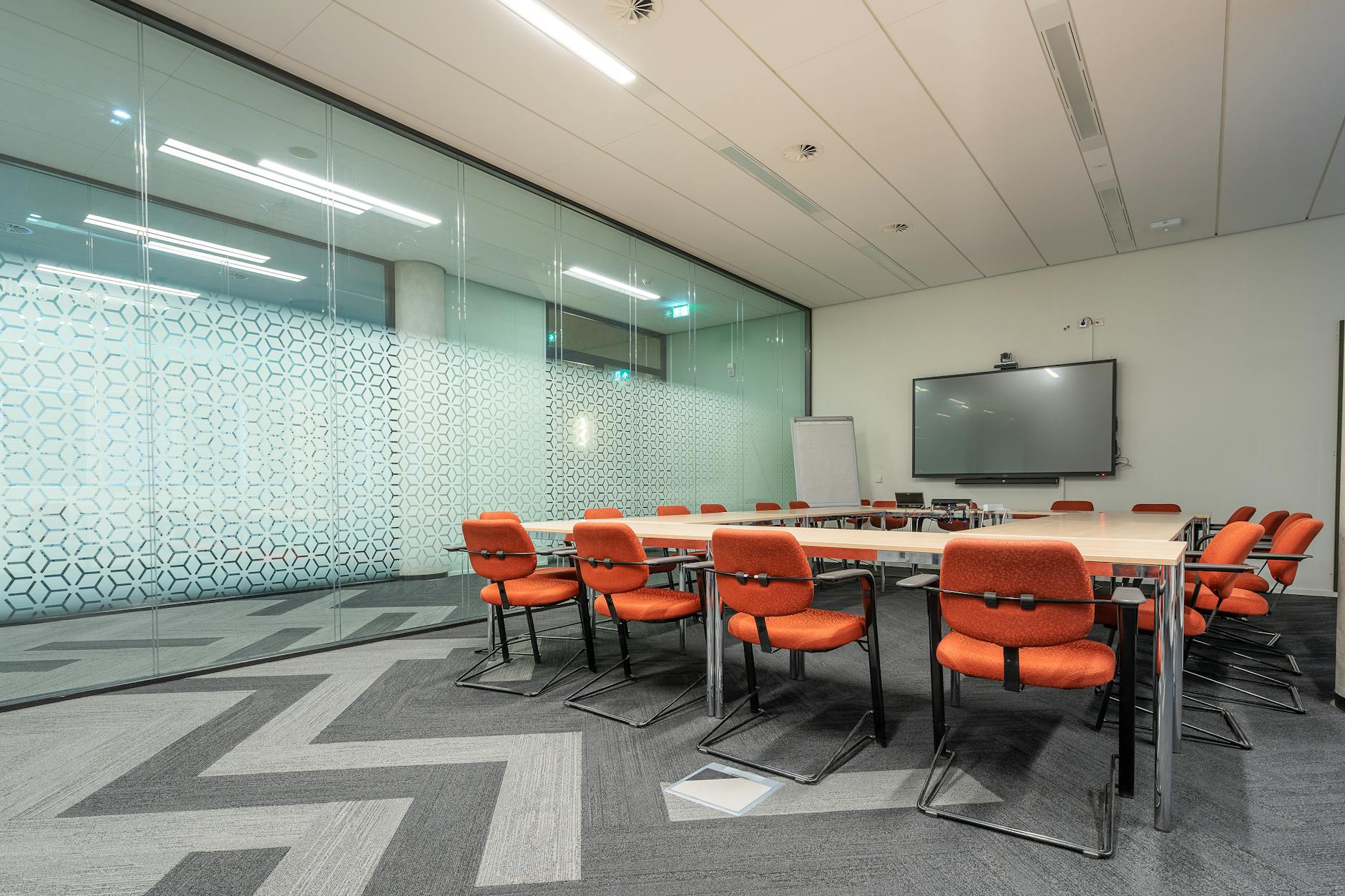 Modern corporate meeting room with business professionals in discussion