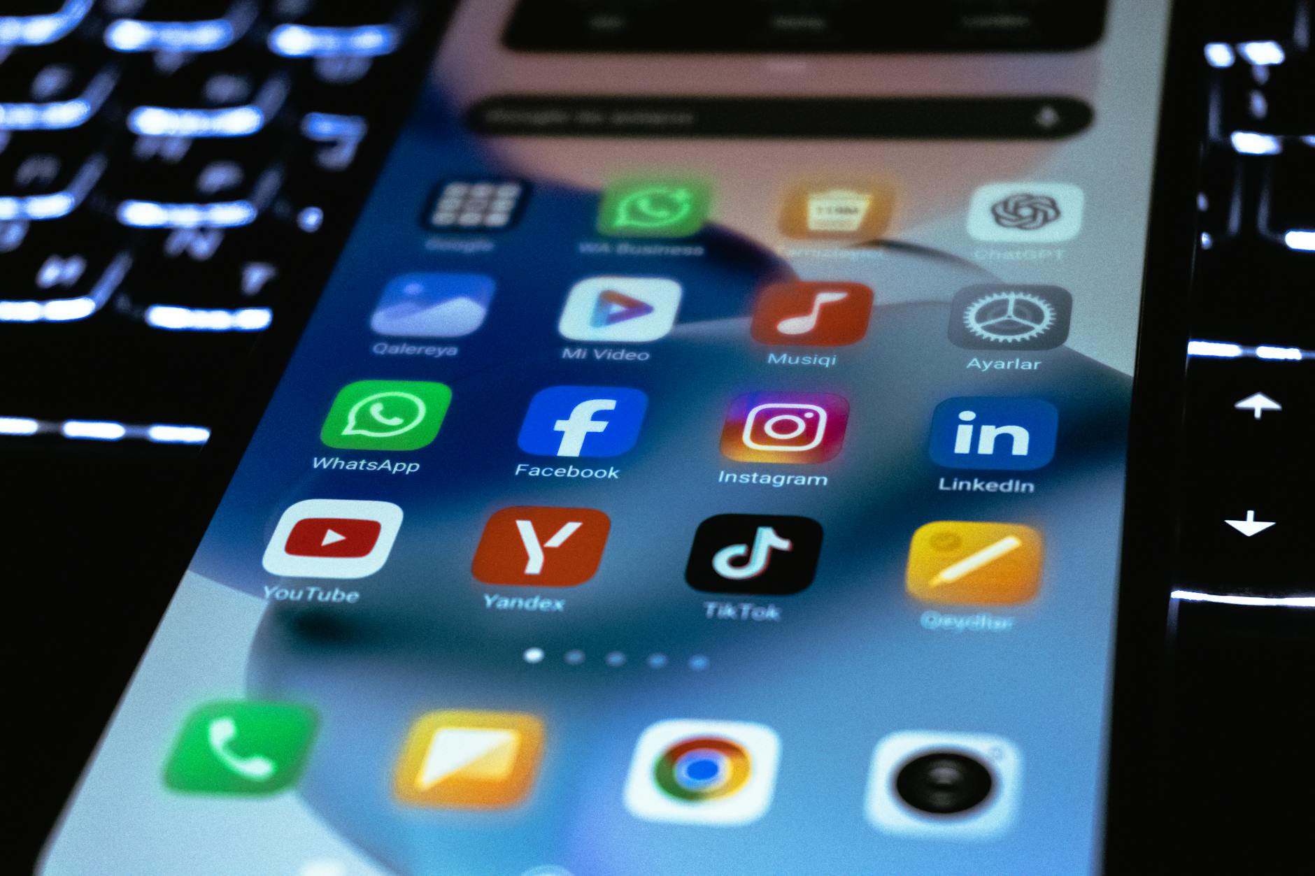 Person holding smartphone showing social media feed with lifestyle content