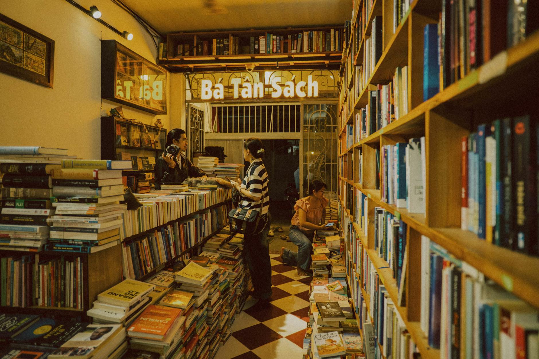 Interior view of bookstore with filled shelves and reading area