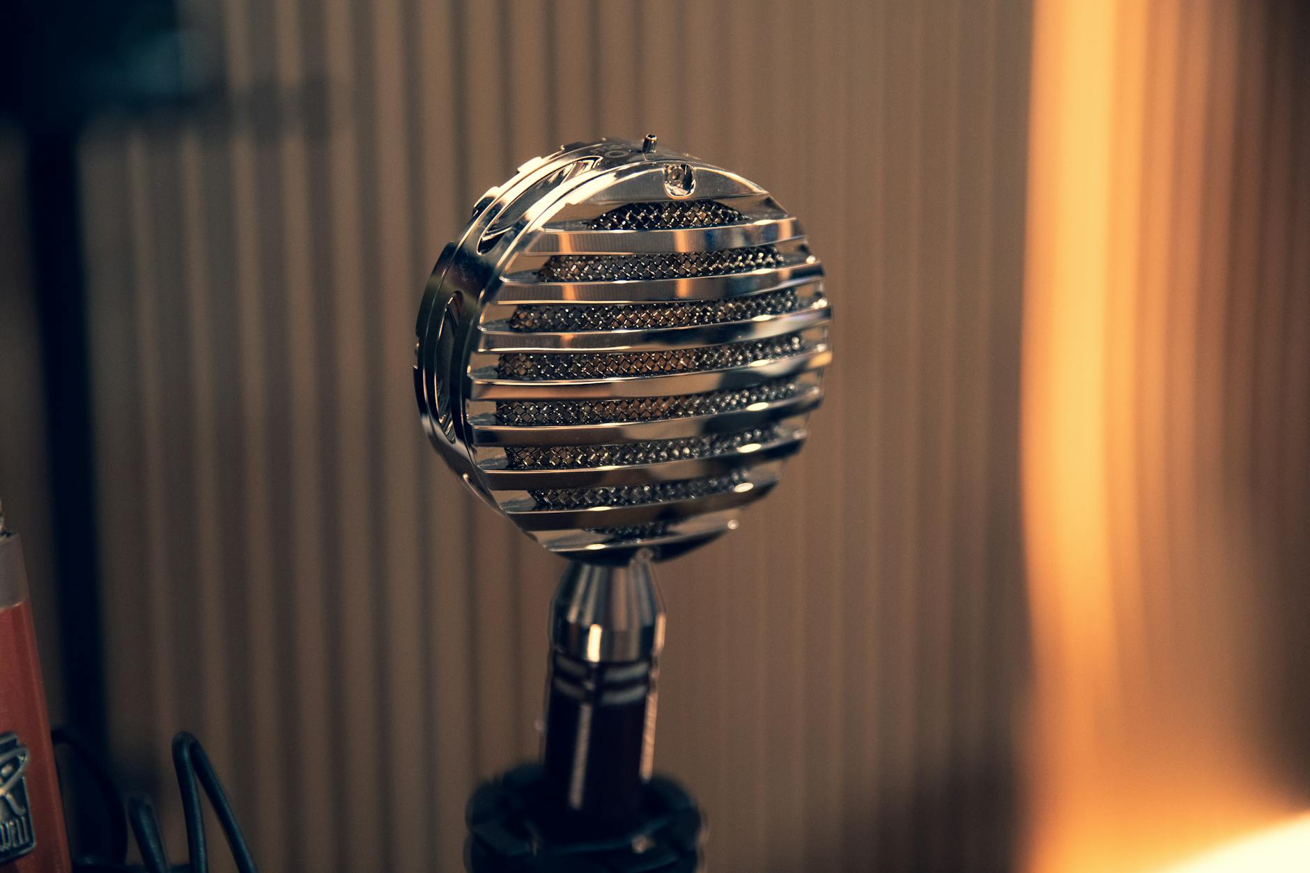 Close-up of a classic vintage microphone in a recording setting