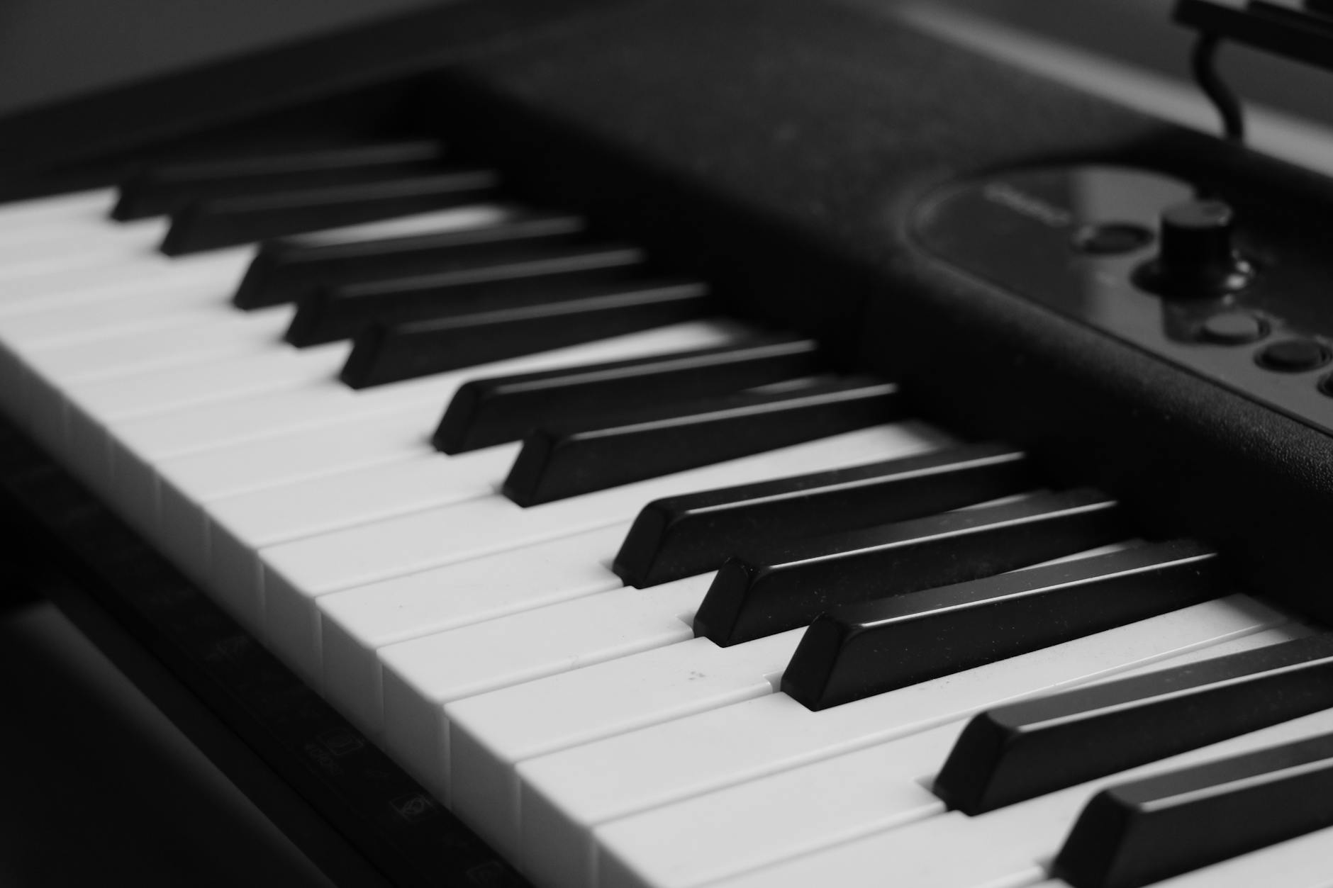 Close-up of piano keyboard keys in dramatic lighting