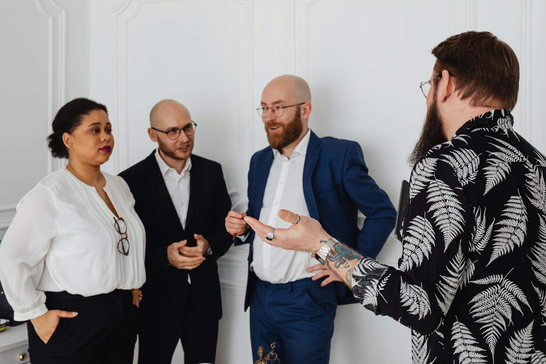 Group of people having casual conversation at networking event