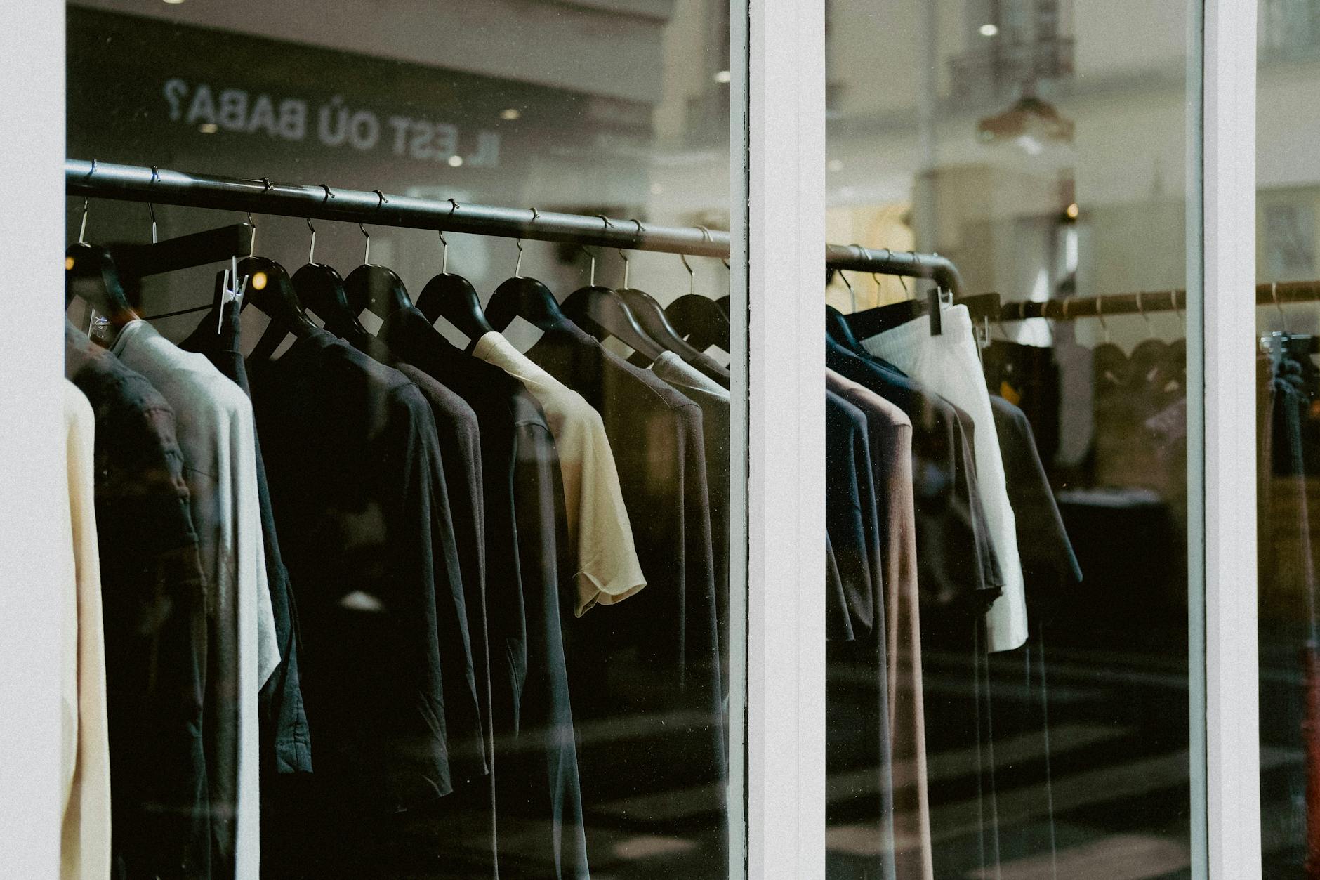 Interior of upscale fashion retail store with clothing displays