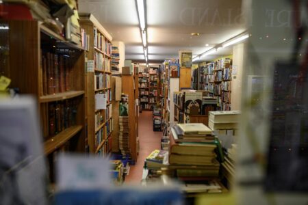 Cozy independent bookstore interior with wooden shelves and warm lighting