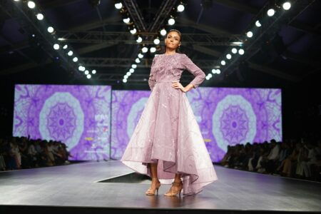 Miuccia Prada’s Miu Miu Is Outselling the Main Line Again Models walking a high-fashion runway show in avant-garde clothing
