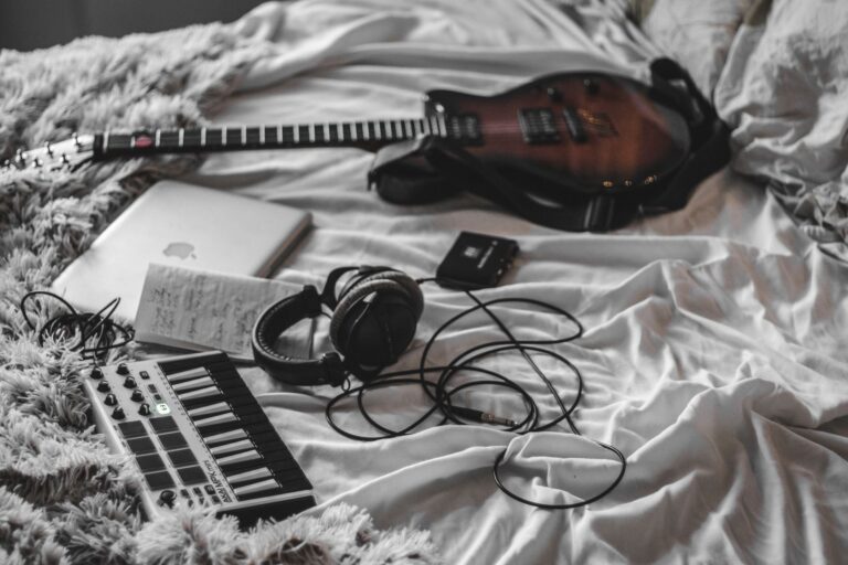 Olivia Rodrigo’s Label Is Quietly Signing Bedroom Pop Artists A young artist recording music in a home bedroom studio setup with a laptop and microphone