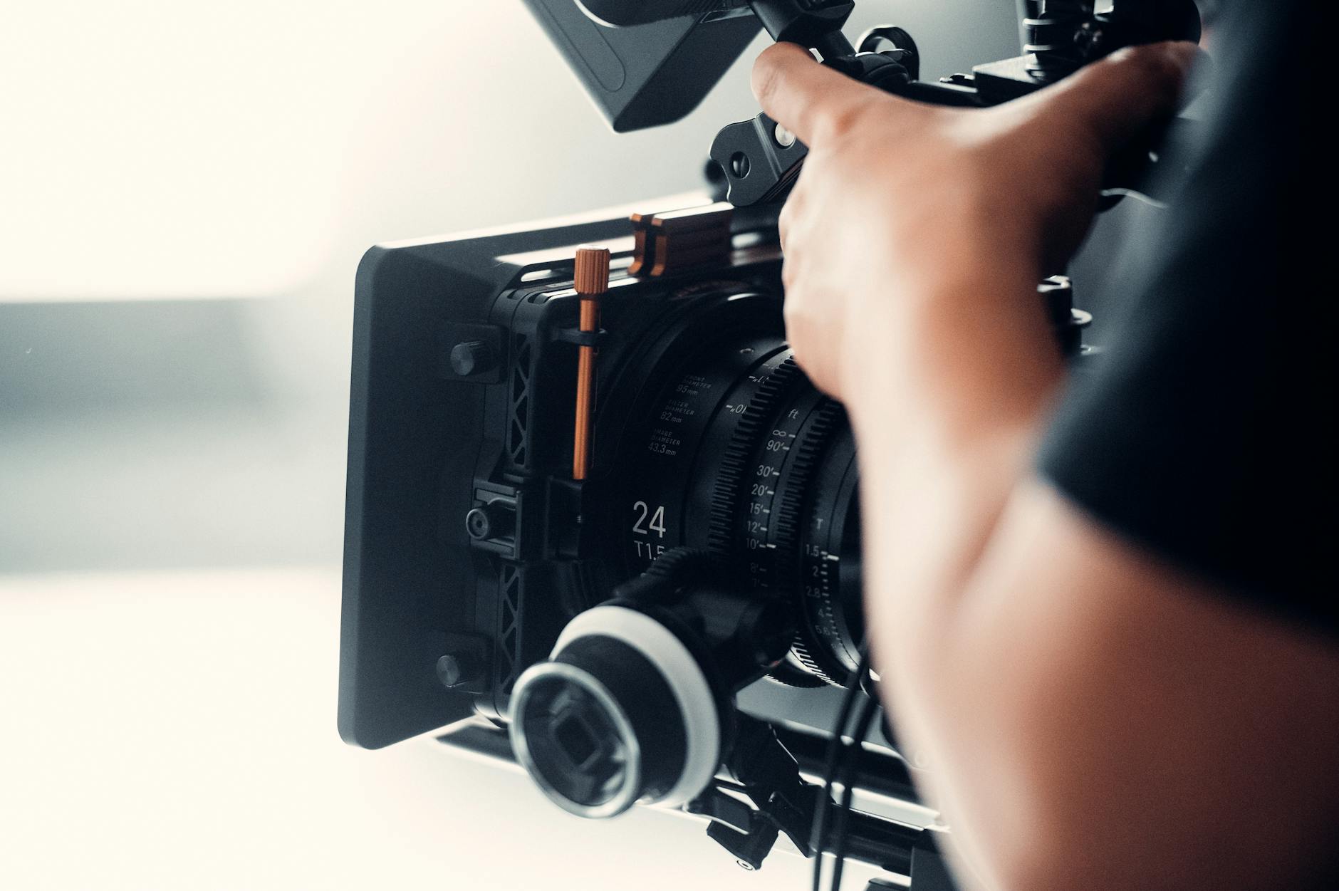 A film camera on a professional movie set, representing the world of acting and production
