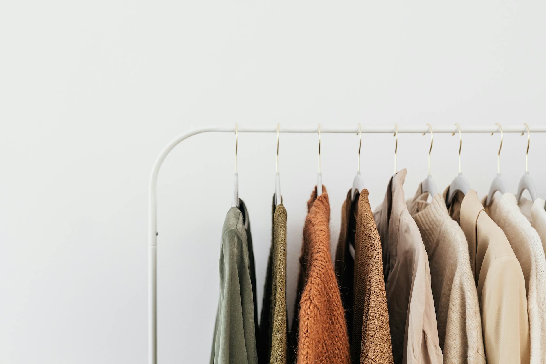 Emerging designer garments hanging neatly on a minimalist clothing rack