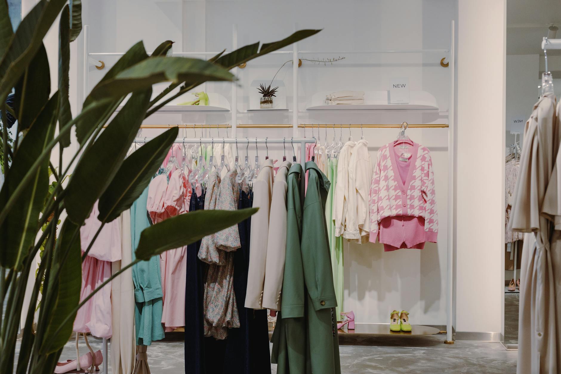 Interior of a high-end luxury fashion boutique with designer clothing displays