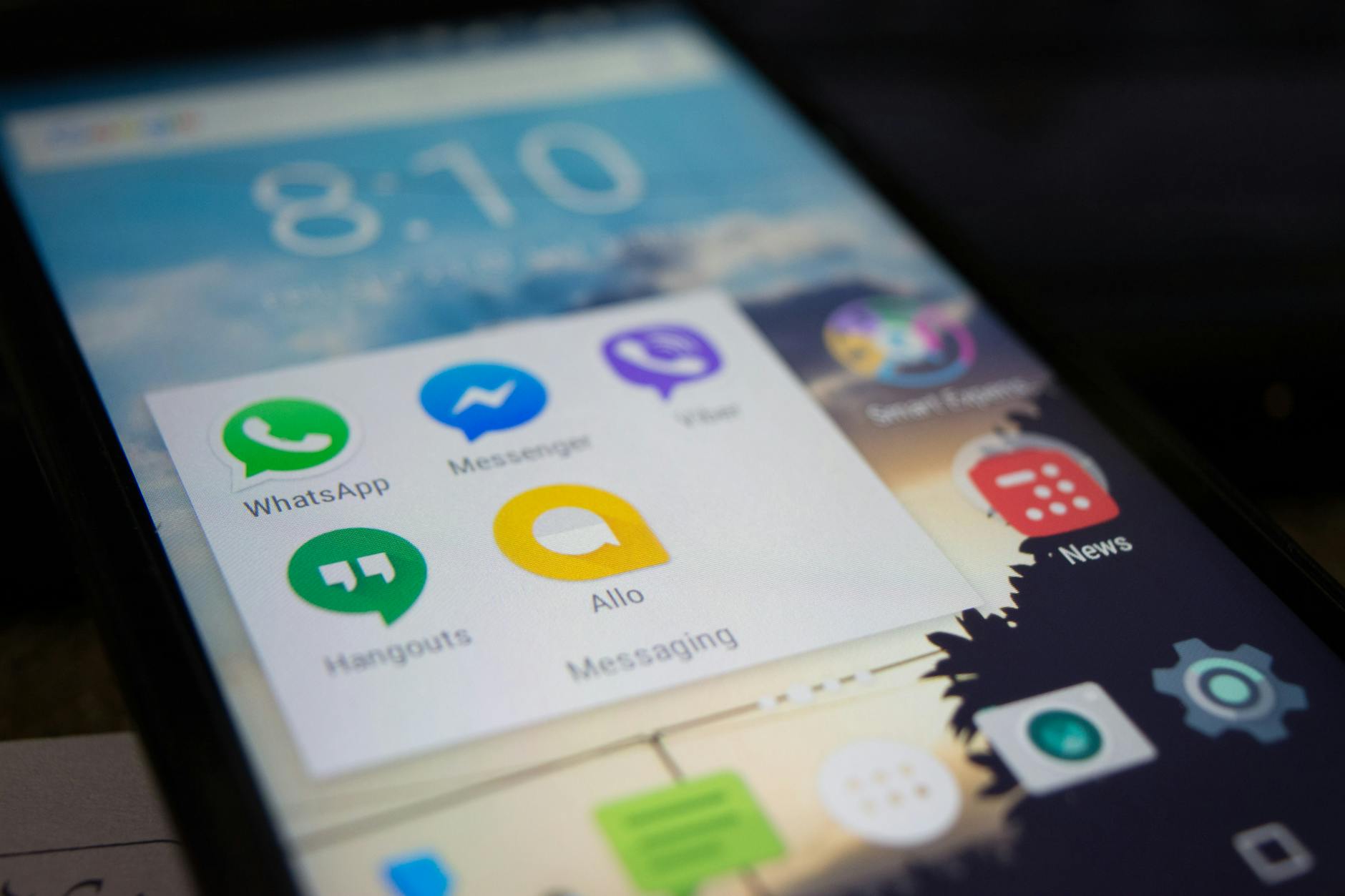 Smartphone displaying multiple streaming app icons on home screen