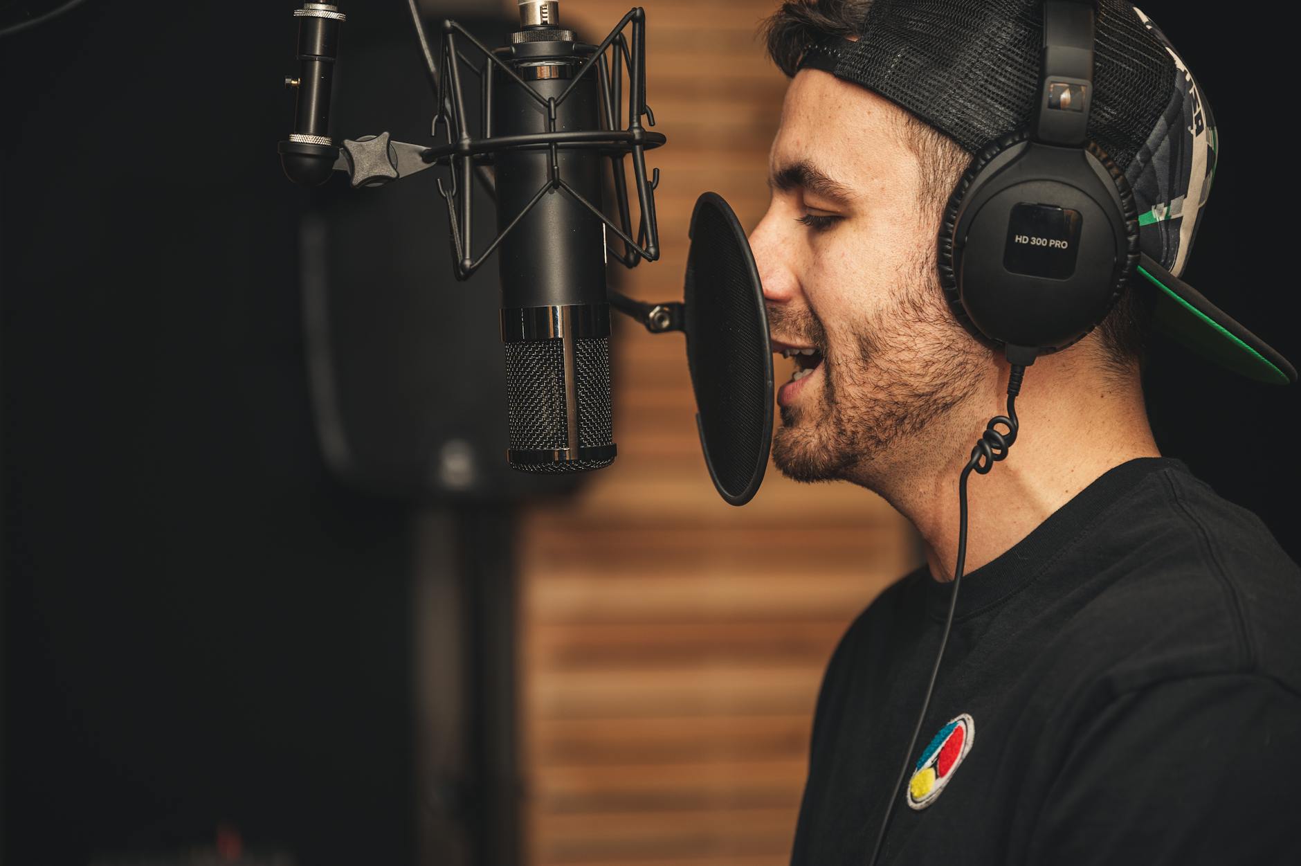 Recording studio interior with mixing board and microphone, representing music production