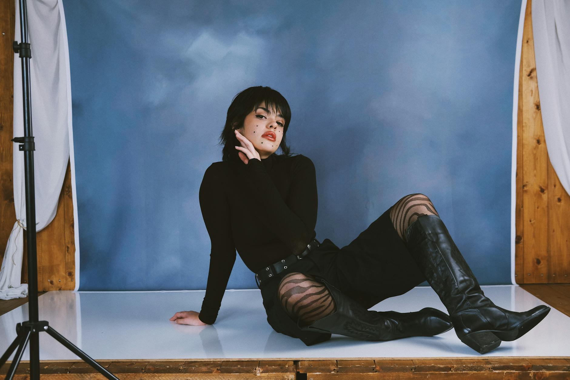 Behind-the-scenes of a fashion editorial photo shoot with styled clothing