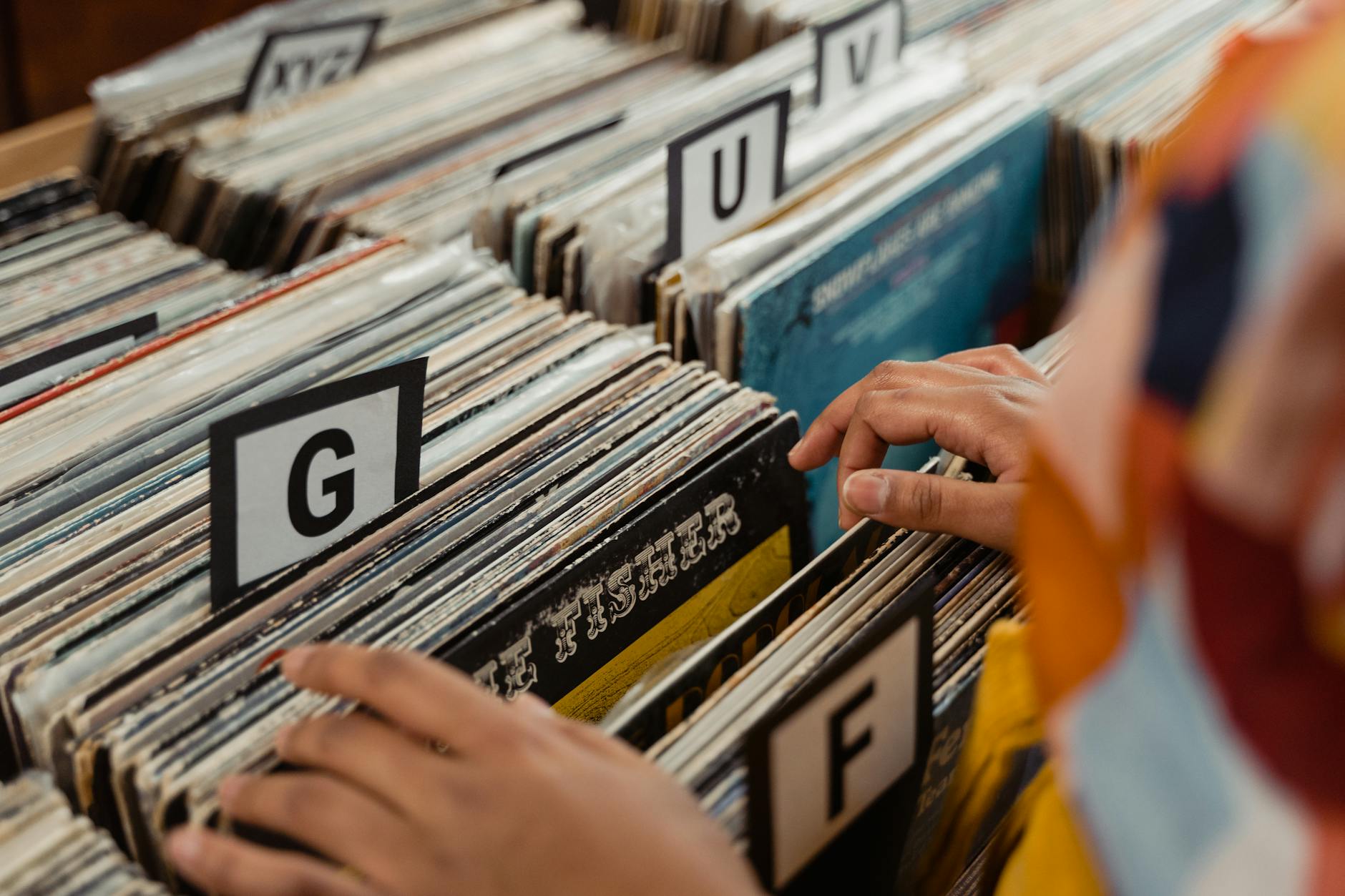 Close-up of vinyl record collection showing album covers and spines