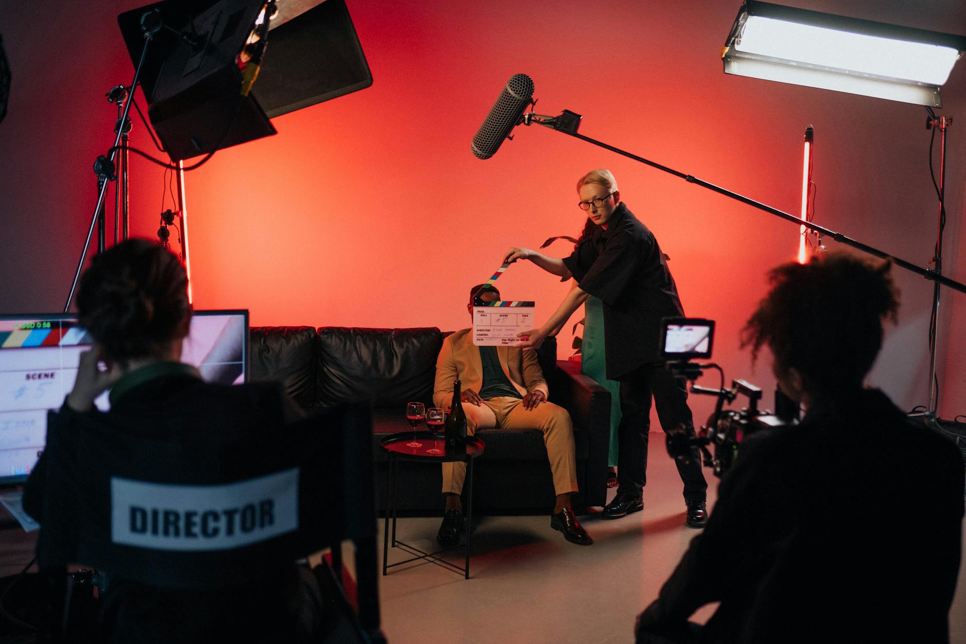 Female director reviewing footage on monitor during film production