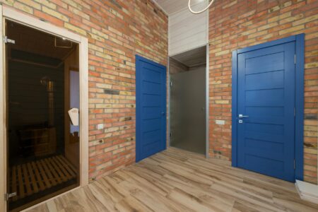 Sauna Clubs Are Quietly Replacing Cocktail Bars in Major Cities Warm wooden sauna interior with benches and soft lighting, designed for communal use