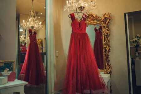Valentino’s All-Red Looks Are Creeping Back Onto the Red Carpet A model wearing a bold red monochromatic gown on a fashion runway
