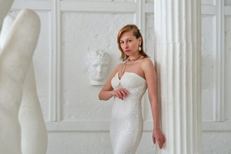 A sculpted, body-conscious dress on display, highlighting precise tailoring and structured silhouette