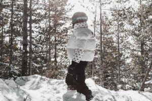 Moncler’s Puffer Jackets Are Edging Into Tailored Office Dressing A sleek, tailored puffer jacket laid flat against a neutral background, suggesting office-appropriate outerwear styling