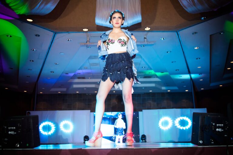 Coperni’s Viral Runway Moments Are Translating Into Real Sales Models walking a high-concept fashion runway show with dramatic lighting