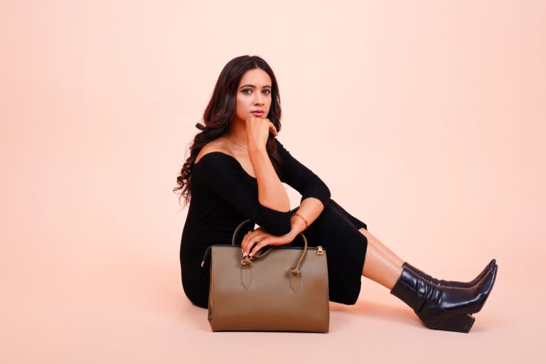 Stella McCartney’s Vegan Leather Is Finally Getting Luxury Respect Close-up of a structured vegan leather handbag with chain detail on a neutral background
