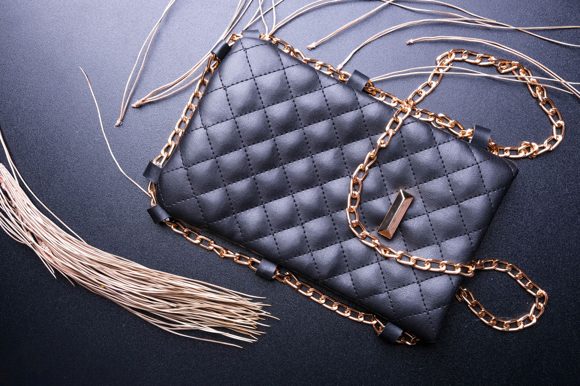 Close-up of a structured geometric leather handbag with folded panel construction