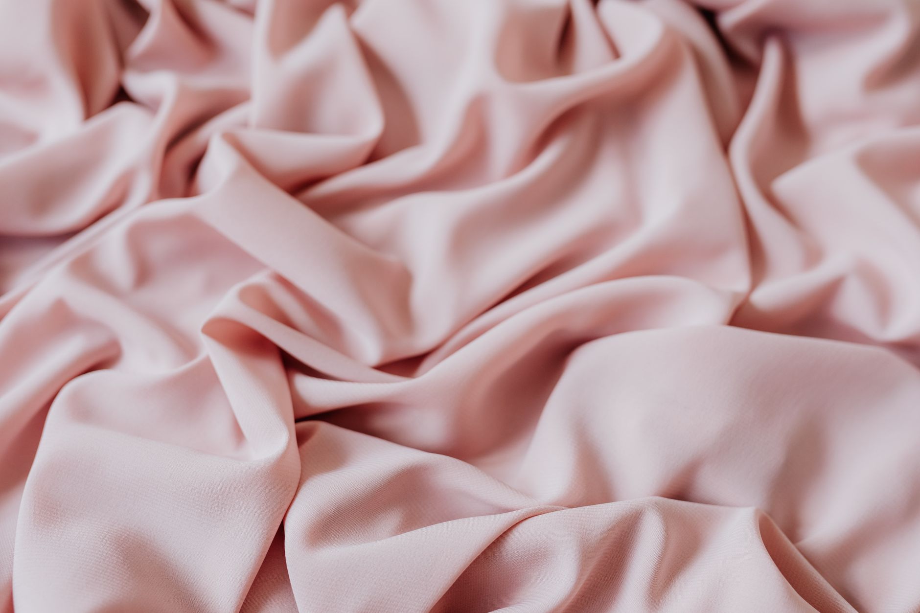 Draped luxury fabric in neutral tones showing texture and movement