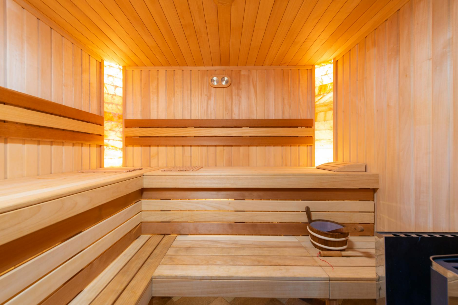 Interior of a contrast therapy wellness space with sauna and cold water facilities