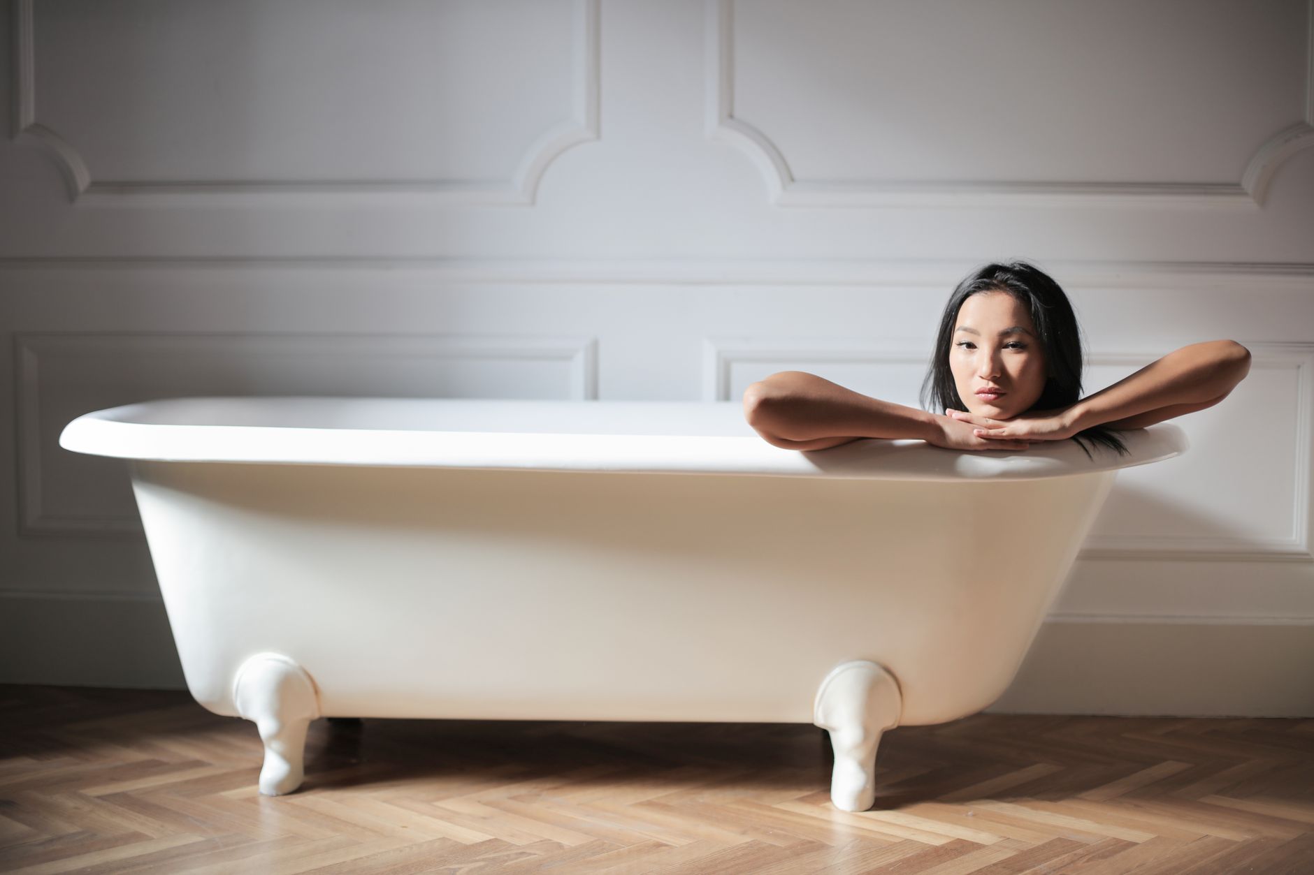 Individual submerged in an ice bath during a cold water immersion recovery session