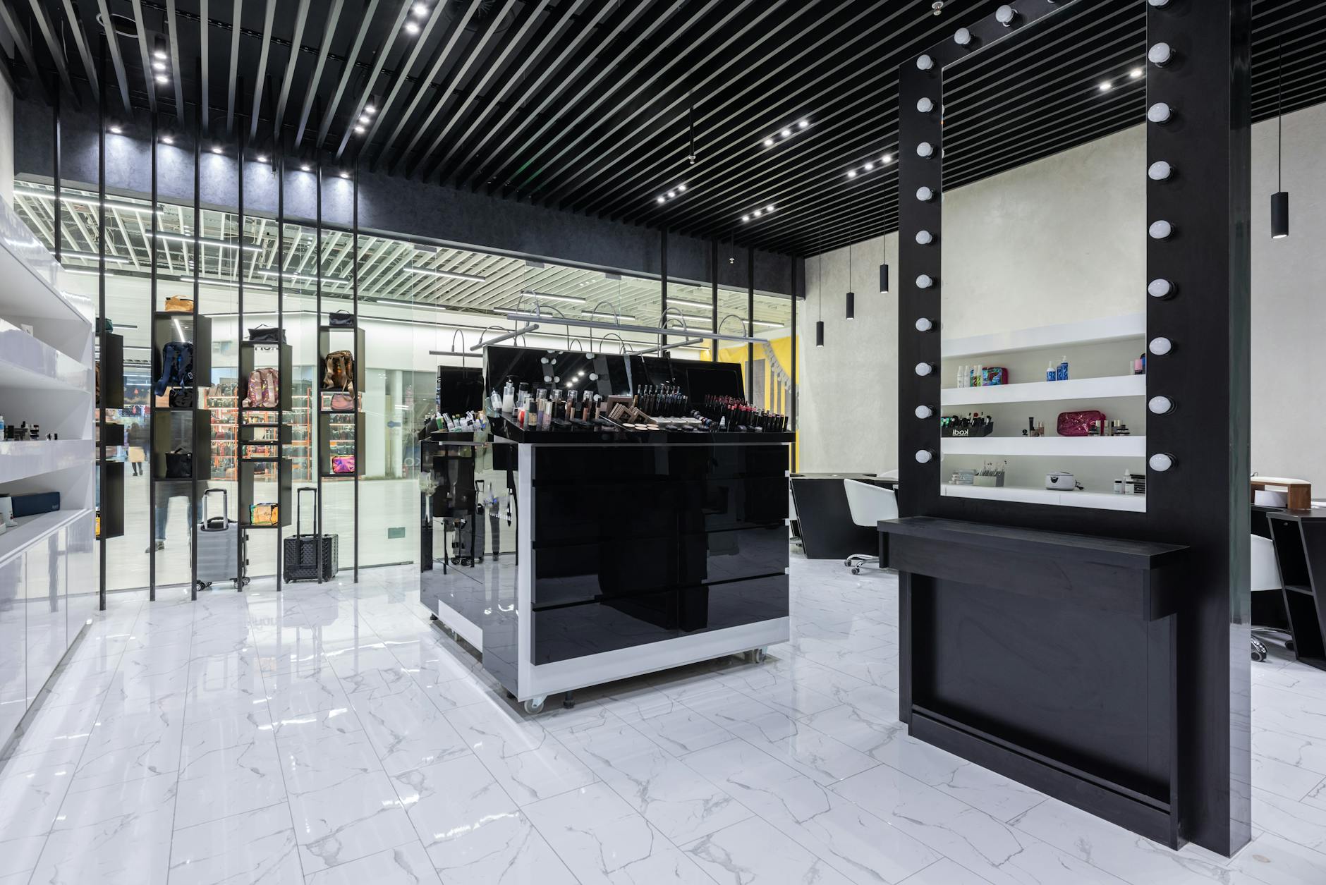 Sparse, architectural interior of a minimalist fashion retail store with neutral tones