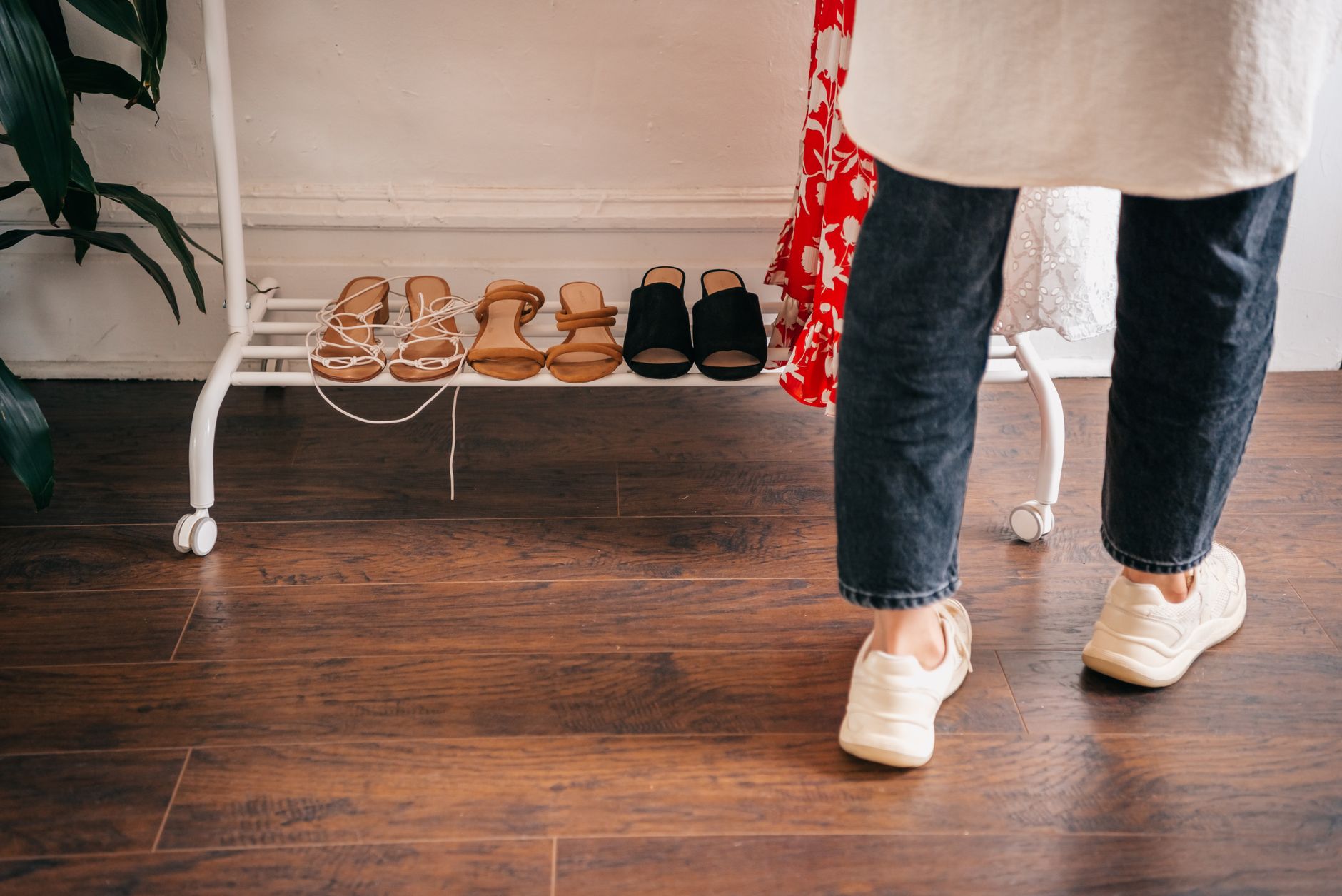 Organized collection of shoes on shelving in a modern wardrobe