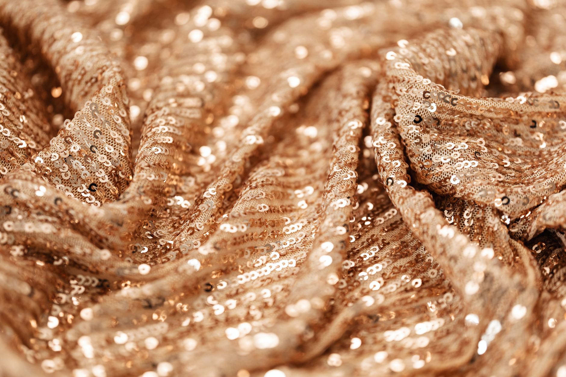 Close-up detail of an embroidered fabric on a high-end garment