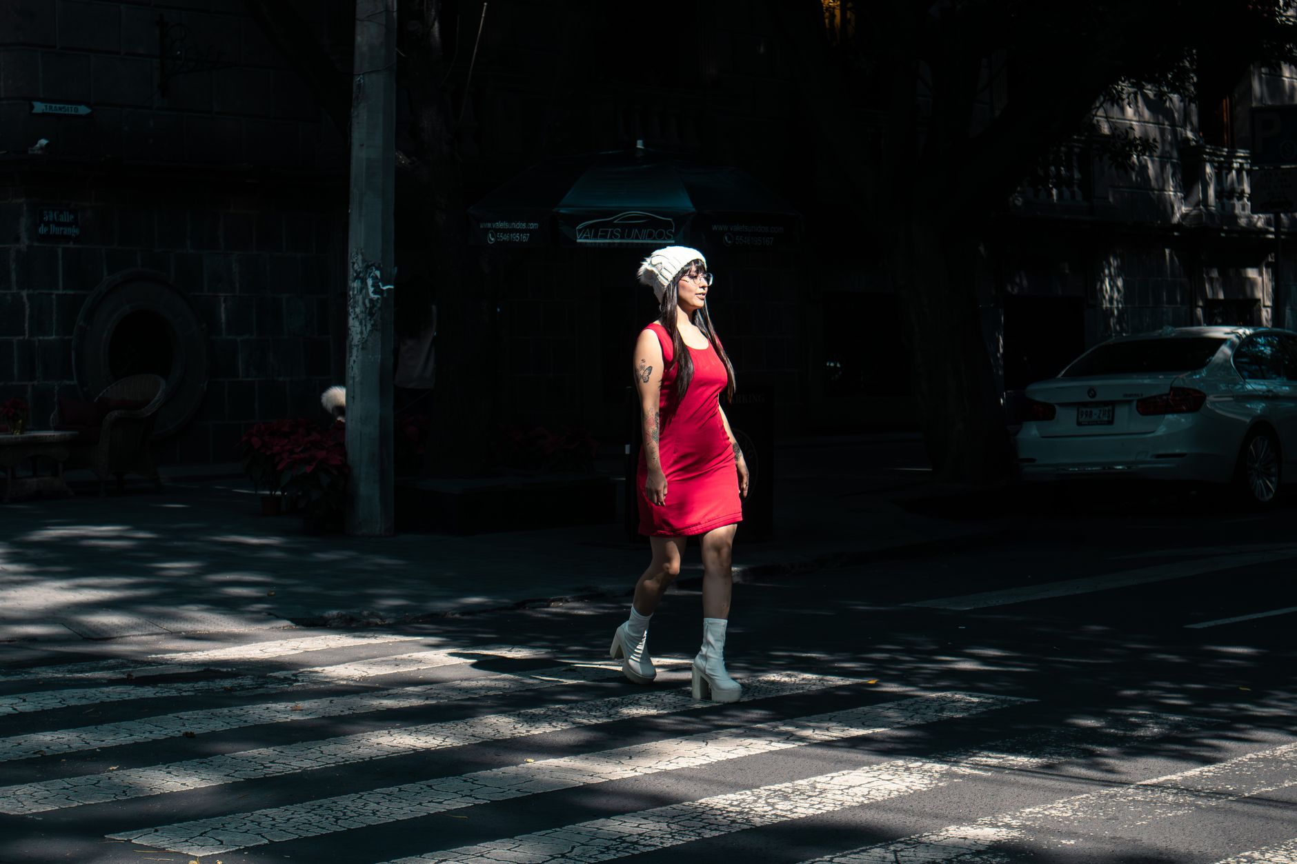 Woman in stylish outfit photographed on a city street